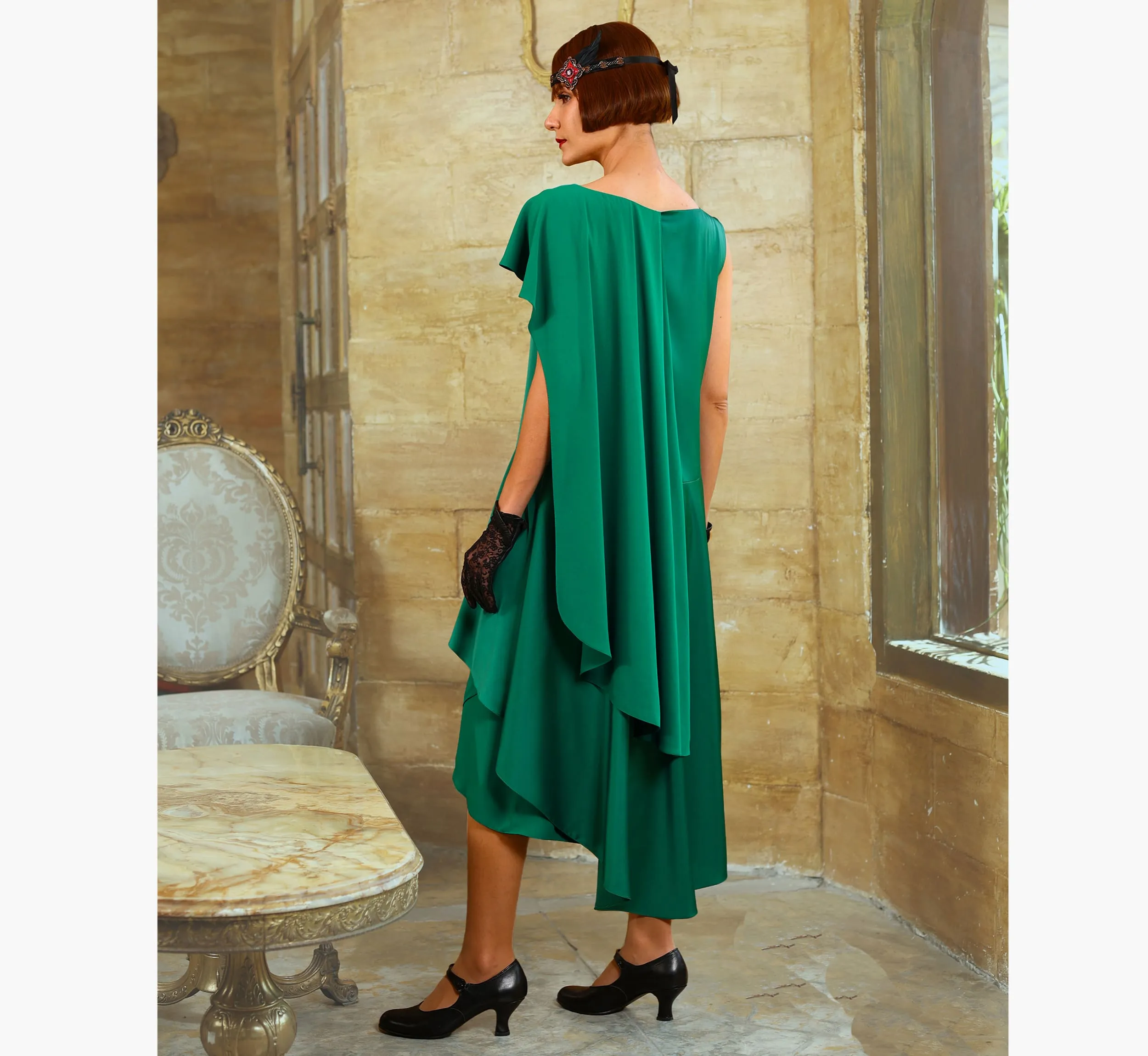 Green 1920s evening satin dress with a shoulder train
